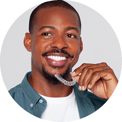 Man holding Reveal Clear Aligners